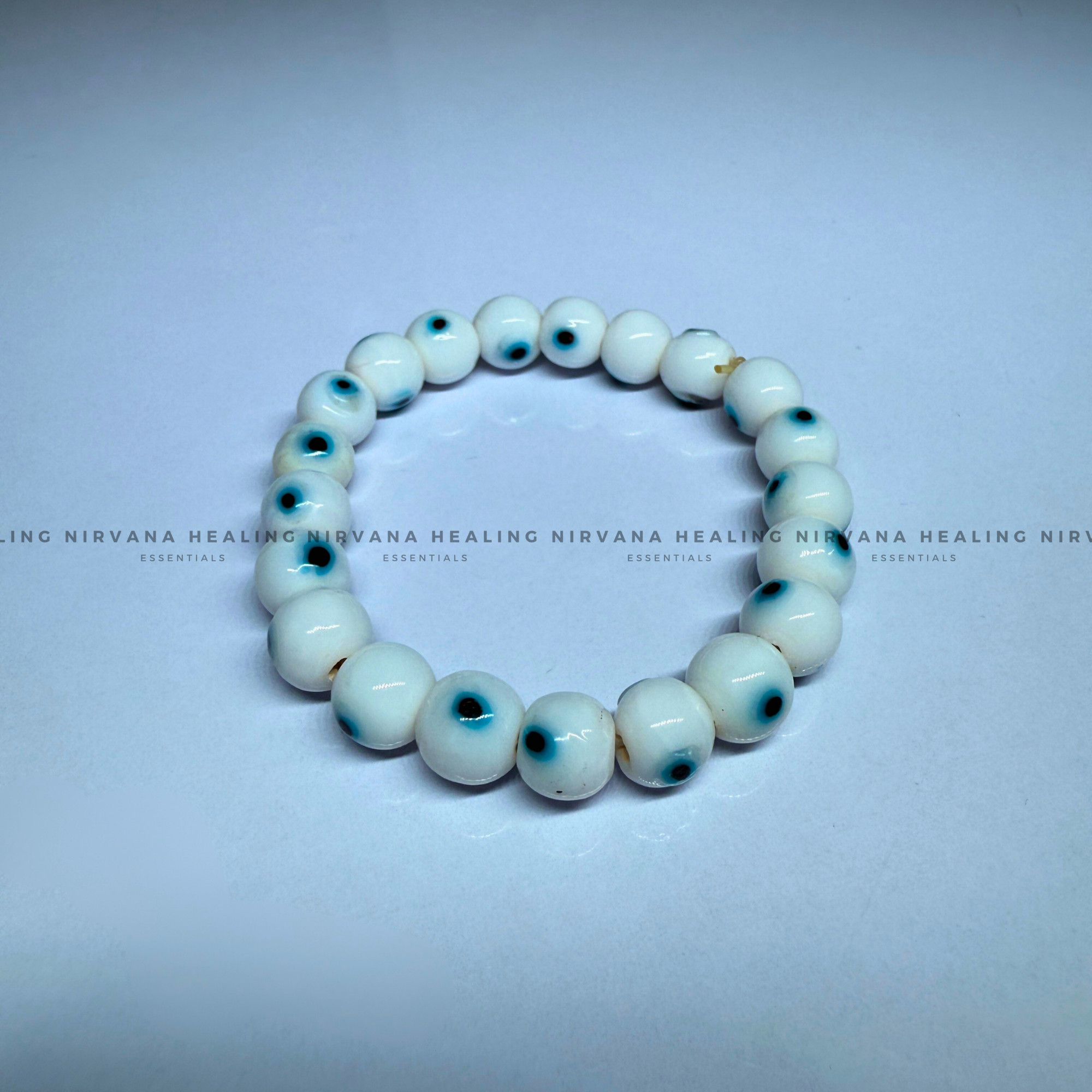 WHITE EVIL EYE ROUND BEADED BRACELET (Purity, Protection And New Beginnings) - Image 2